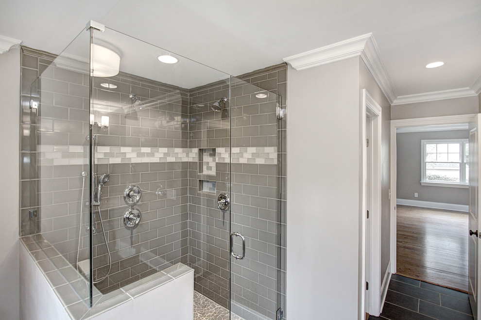 Photo of a medium sized classic ensuite bathroom in Charlotte with a shower/bath combination, a two-piece toilet, white tiles, ceramic tiles, beige walls, ceramic flooring and a submerged sink.