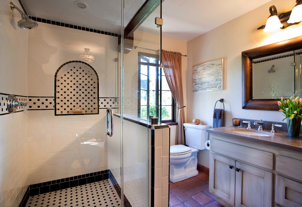 Example of a tuscan bathroom design in San Diego with an undermount sink