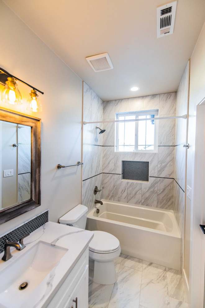 Example of a mid-sized transitional 3/4 beige tile and ceramic tile single-sink bathroom design in Sacramento with shaker cabinets, white cabinets, an undermount sink, quartzite countertops, white countertops and a built-in vanity