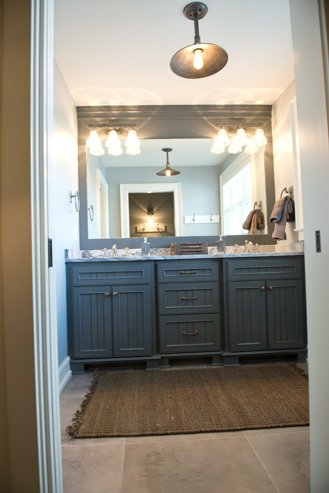 Example of a mid-sized cottage ceramic tile and gray floor alcove shower design in Milwaukee with beaded inset cabinets, green cabinets, blue walls, an undermount sink, quartz countertops and a hinged shower door