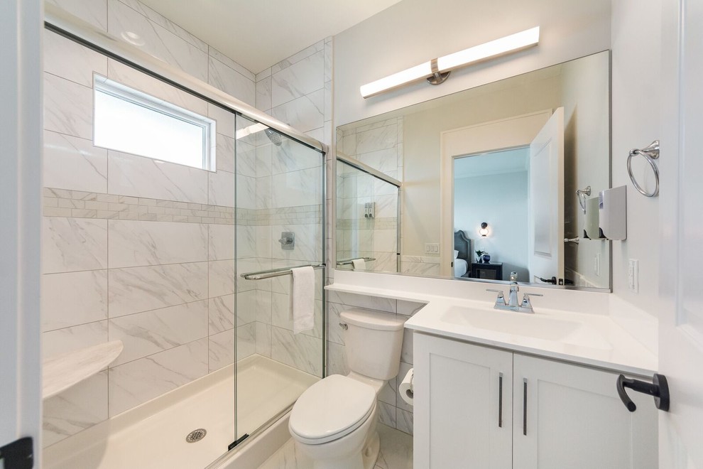 Inspiration for a small classic shower room bathroom in Other with shaker cabinets, white cabinets, an alcove shower, a two-piece toilet, white tiles, marble tiles, beige walls, marble flooring, an integrated sink, marble worktops, white floors and a sliding door.
