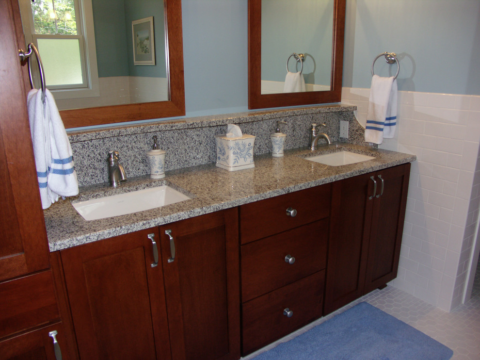 This is an example of a large classic bathroom in Other with shaker cabinets, dark wood cabinets, an alcove bath, metro tiles, brown walls, ceramic flooring, a submerged sink and granite worktops.