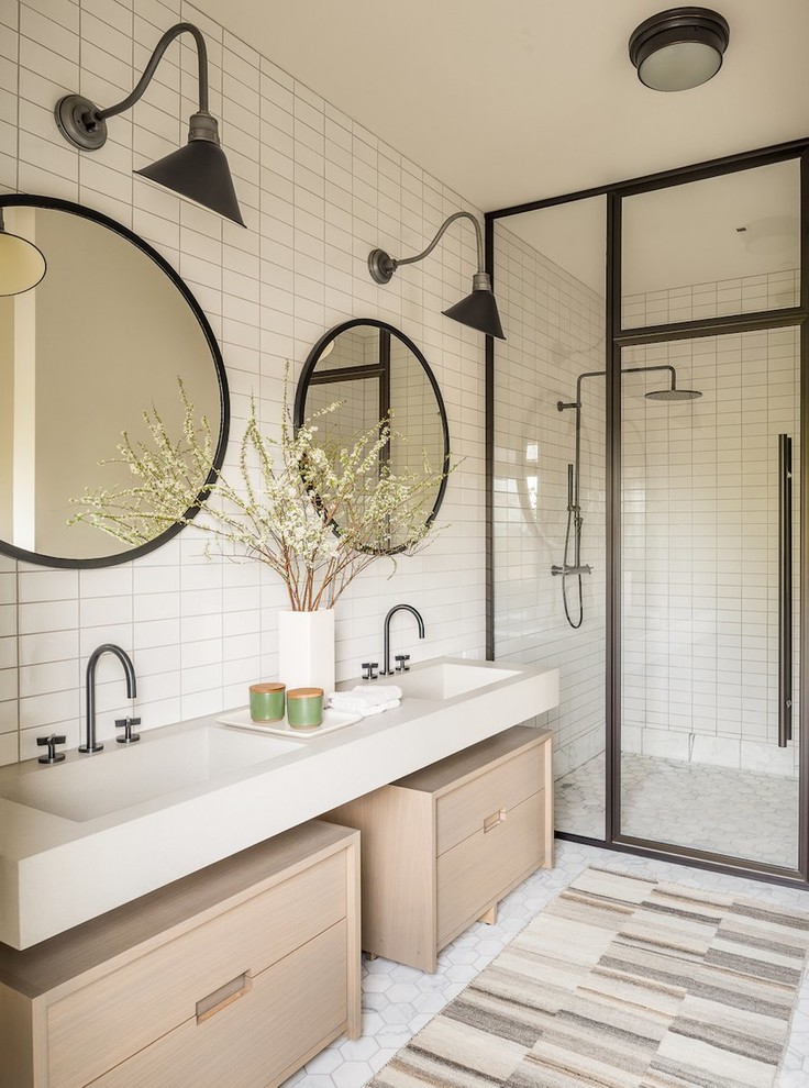 Farmhouse 3/4 white tile walk-in shower photo in New York with light wood cabinets, an integrated sink, a hinged shower door, beige countertops and flat-panel cabinets