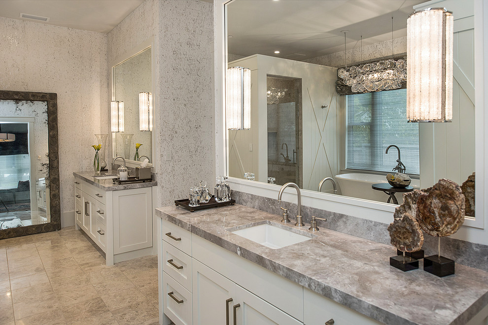 Photo of a medium sized rural ensuite bathroom in San Francisco with shaker cabinets, white cabinets, a freestanding bath, a corner shower, white walls, porcelain flooring, a submerged sink, marble worktops, beige floors and a hinged door.