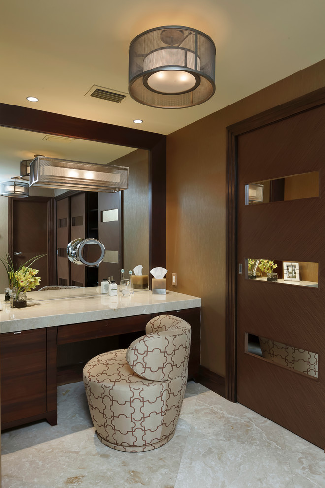 This is an example of a large contemporary ensuite bathroom in Miami with freestanding cabinets, dark wood cabinets, a built-in bath, a double shower, brown tiles, multi-coloured tiles, stone slabs, brown walls, travertine flooring, a submerged sink and marble worktops.