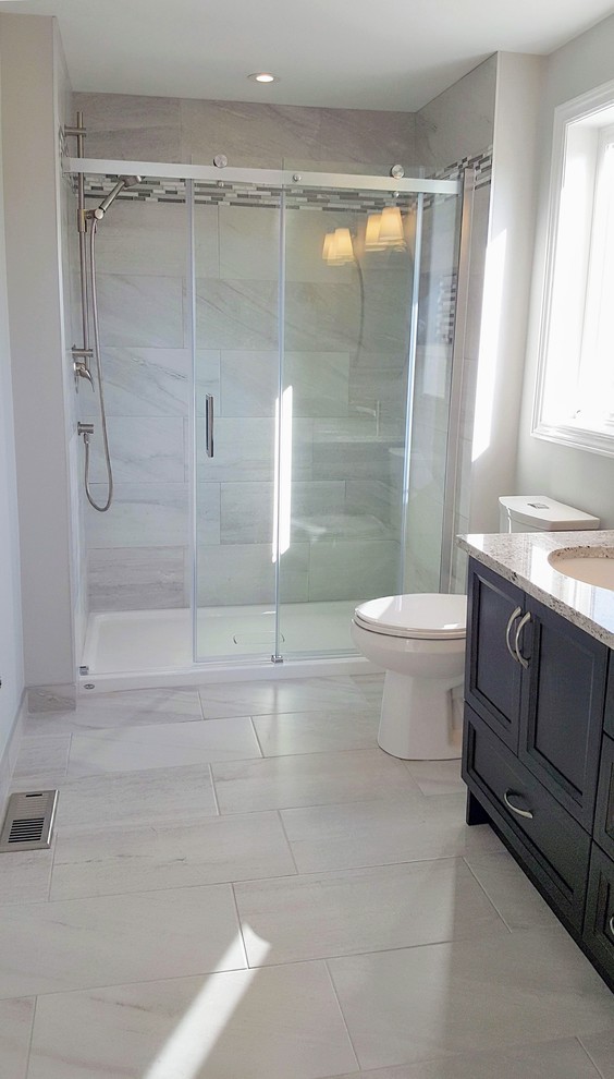 Example of a transitional 3/4 multicolored tile and mosaic tile double-sink bathroom design in Toronto with brown cabinets, gray walls, a niche and a built-in vanity