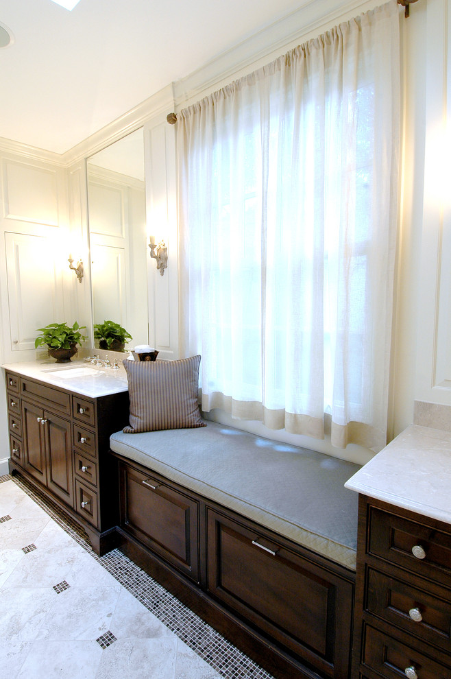 Example of a huge transitional master mosaic tile floor alcove bathtub design in Nashville with an undermount sink, raised-panel cabinets, dark wood cabinets, limestone countertops and white walls