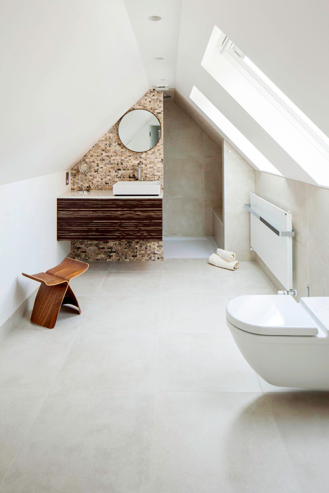 Large trendy gray floor bathroom photo in Cambridgeshire with flat-panel cabinets, brown cabinets, a wall-mount toilet and white walls