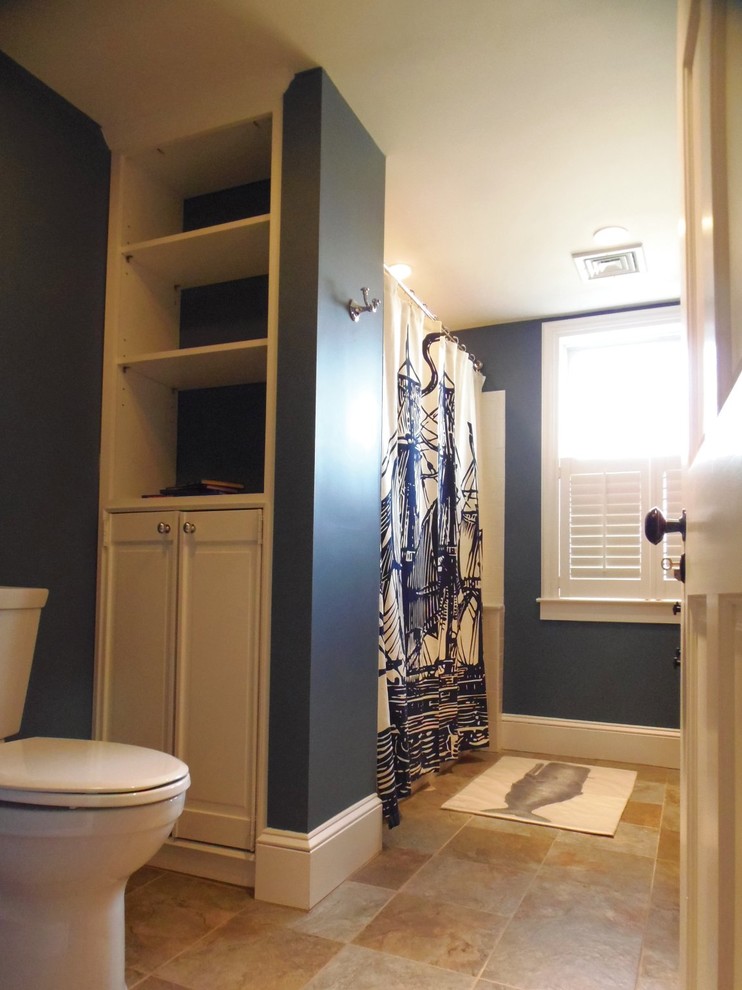 Inspiration for a classic bathroom in Philadelphia with freestanding cabinets, dark wood cabinets, marble worktops, an alcove bath, an alcove shower, a two-piece toilet, brown tiles, porcelain tiles, blue walls and porcelain flooring.