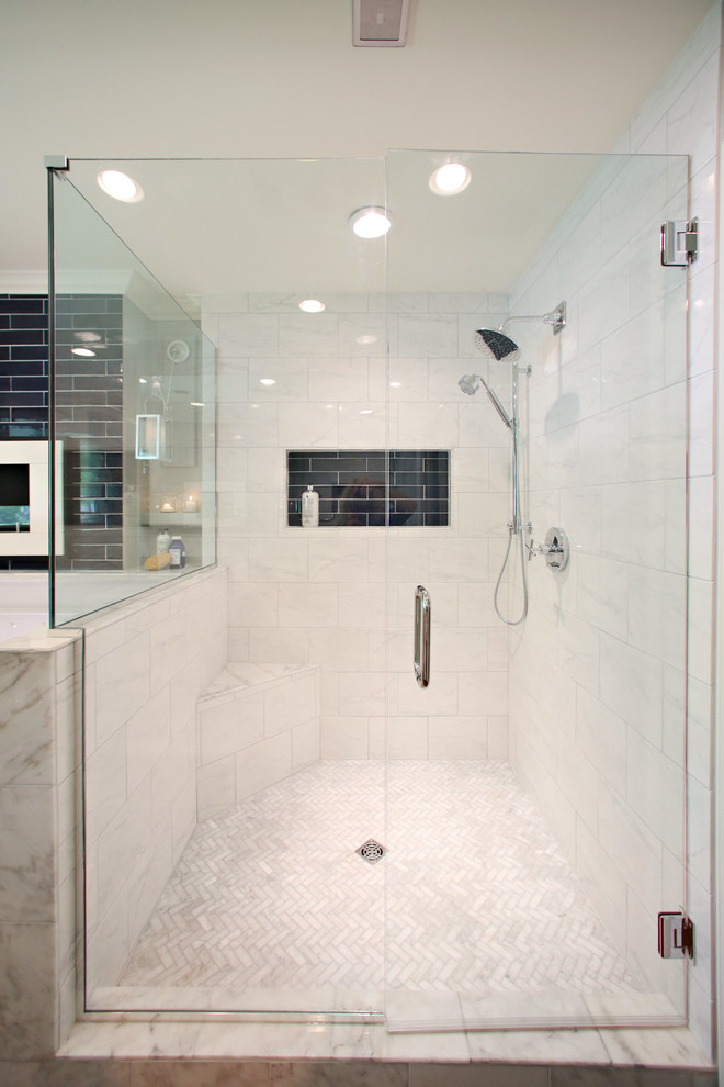 This is an example of a large modern ensuite bathroom in Minneapolis with recessed-panel cabinets, white cabinets, a freestanding bath, a walk-in shower, blue tiles, ceramic tiles, grey walls, dark hardwood flooring, marble worktops, a one-piece toilet and a submerged sink.