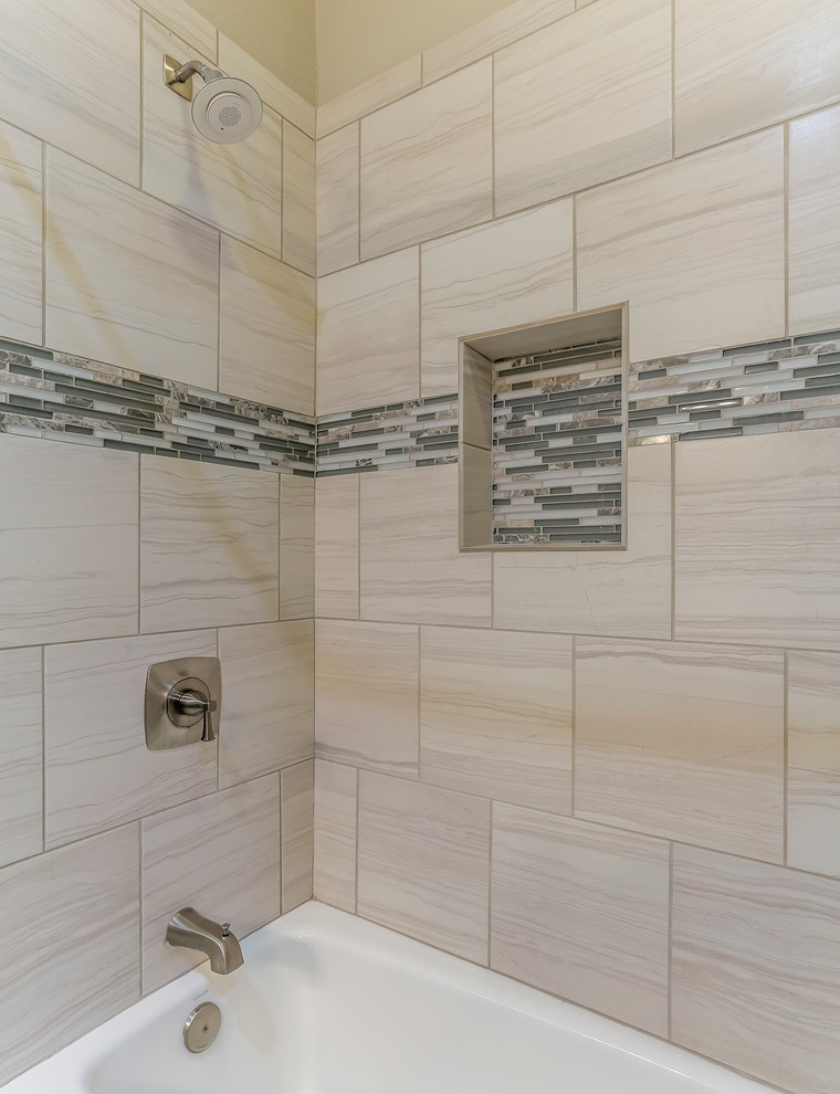 Example of a mid-sized beach style master beige tile and porcelain tile limestone floor bathroom design in Houston with raised-panel cabinets, gray cabinets, a two-piece toilet, gray walls, an undermount sink and quartz countertops