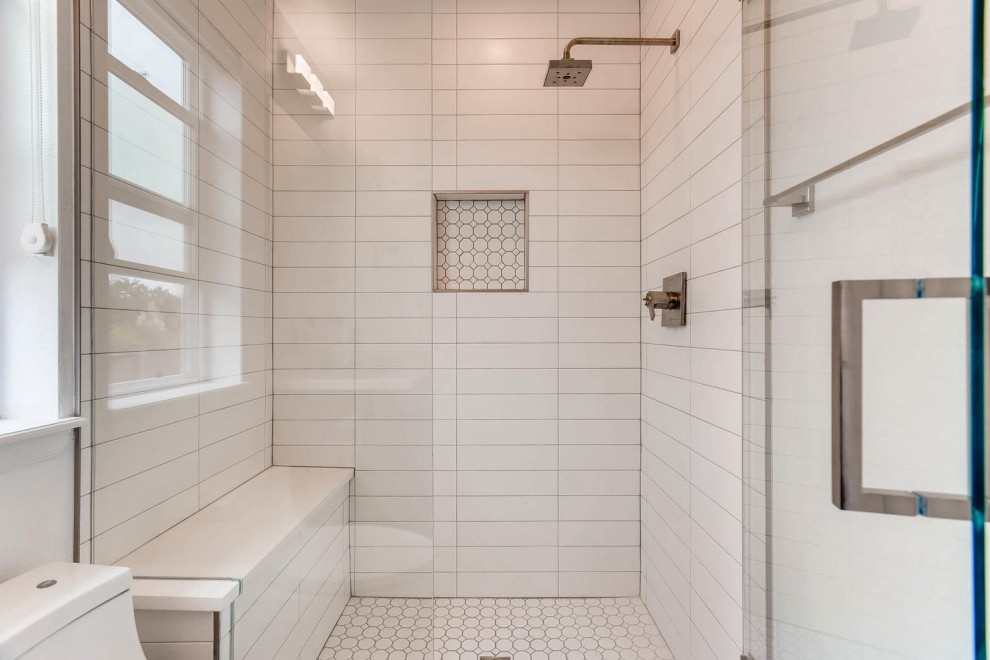 Photo of a medium sized contemporary ensuite bathroom in Denver with an alcove shower, a one-piece toilet, white tiles, porcelain flooring, white floors, a hinged door and a wall niche.