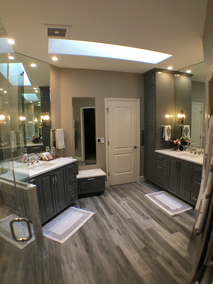 This is an example of a medium sized traditional ensuite bathroom in Portland with beaded cabinets, grey cabinets, a built-in shower, a one-piece toilet, white tiles, porcelain tiles, beige walls, porcelain flooring, a submerged sink, engineered stone worktops, grey floors and a hinged door.