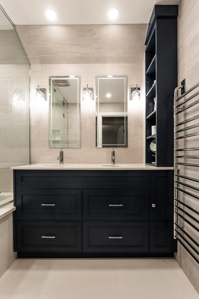 Doorless shower - mid-sized contemporary master beige tile and ceramic tile ceramic tile and beige floor doorless shower idea in Montreal with shaker cabinets, blue cabinets, an undermount tub, a one-piece toilet, beige walls, an undermount sink, quartz countertops and beige countertops