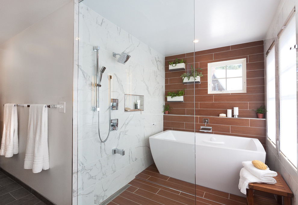 Example of a large trendy master gray tile and porcelain tile mosaic tile floor and brown floor bathroom design in DC Metro with flat-panel cabinets, light wood cabinets, white walls, an undermount sink, quartz countertops and a hinged shower door