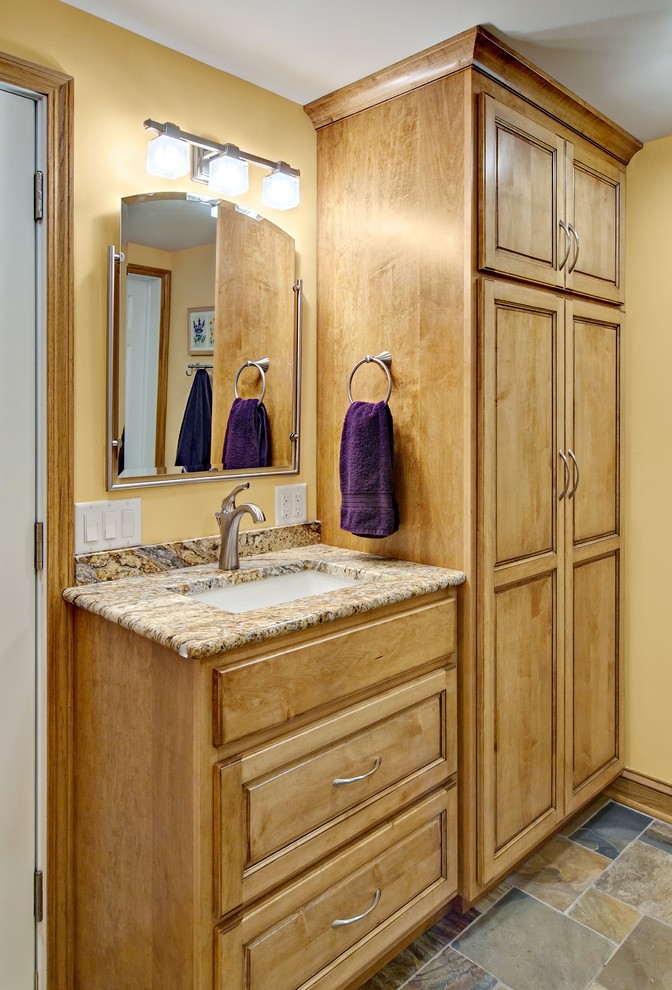 Bathroom - small transitional 3/4 multicolored tile and glass tile slate floor bathroom idea in Minneapolis with an undermount sink, medium tone wood cabinets, granite countertops, a two-piece toilet and yellow walls