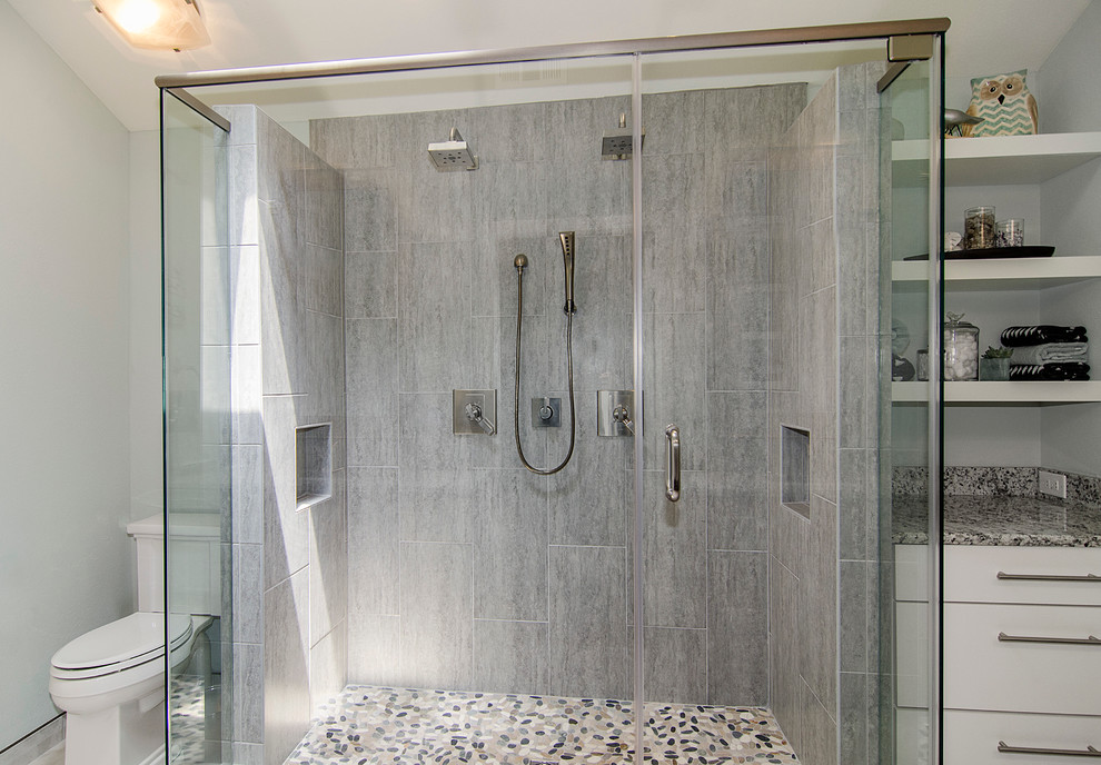 Small transitional master gray tile and ceramic tile ceramic tile double shower photo in Dallas with an undermount sink, shaker cabinets, medium tone wood cabinets, granite countertops, a two-piece toilet and gray walls