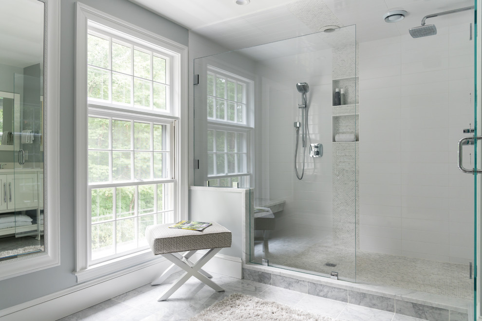 На фото: главная ванная комната среднего размера в стиле неоклассика (современная классика) с душем в нише, белой плиткой, серыми стенами, серым полом, душем с распашными дверями, мраморным полом, врезной раковиной, столешницей из искусственного камня и белой столешницей