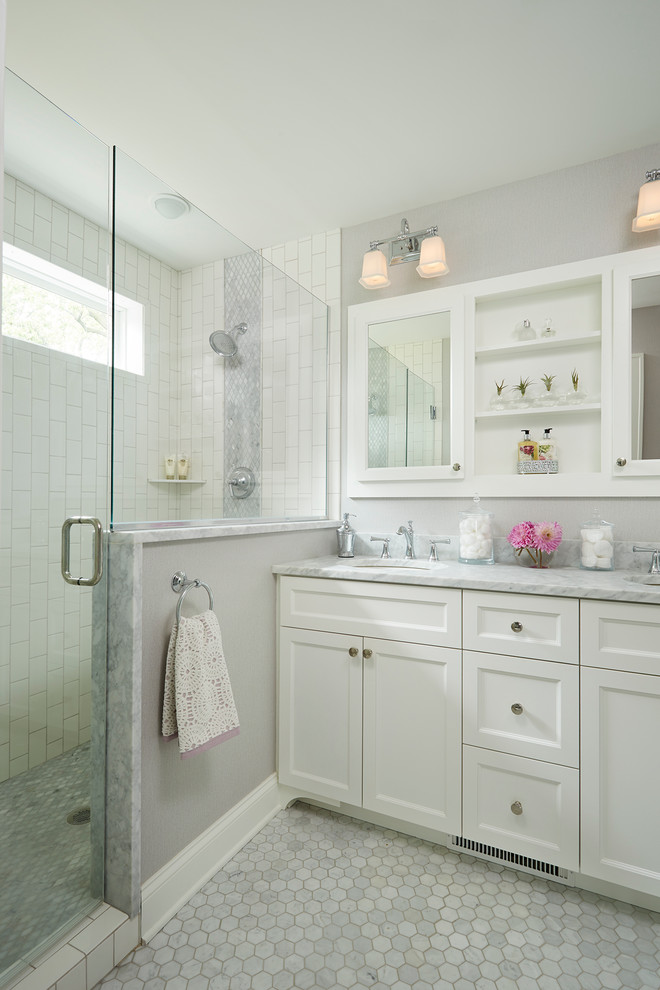 Inspiration for a mid-sized transitional master stone tile and white tile mosaic tile floor alcove shower remodel in Minneapolis with an undermount sink, shaker cabinets, white cabinets, gray walls and marble countertops