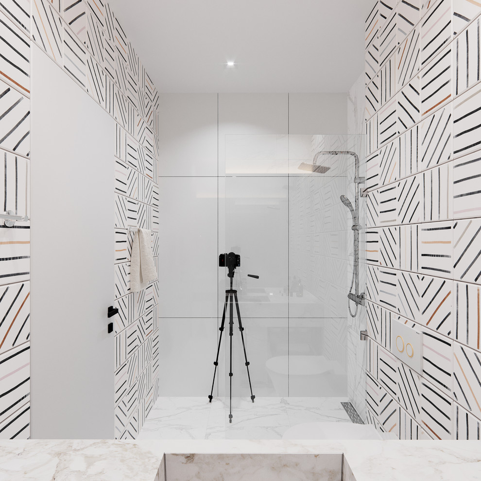 Small contemporary family bathroom in London with open cabinets, white cabinets, a walk-in shower, a wall mounted toilet, multi-coloured tiles, marble tiles, white walls, marble flooring, a wall-mounted sink, marble worktops, white floors and an open shower.
