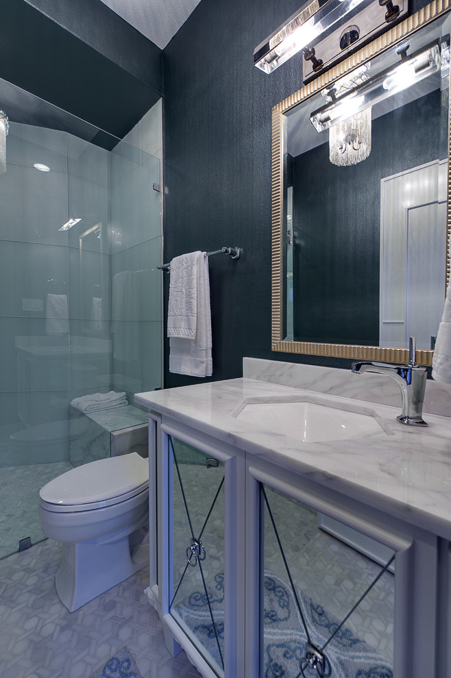 This is an example of a medium sized classic shower room bathroom in Austin with a submerged sink, marble worktops, blue walls, white tiles, ceramic flooring, glass-front cabinets, white cabinets, an alcove shower, a two-piece toilet, grey floors, a hinged door and white worktops.