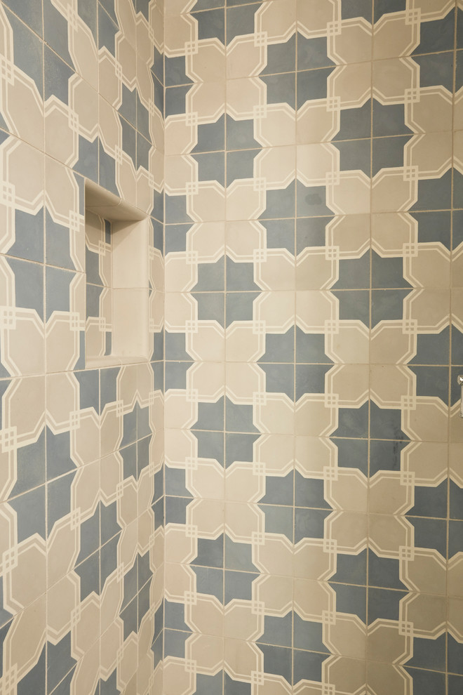 Inspiration for a mediterranean blue tile and cement tile bathroom remodel in Chicago with a hinged shower door
