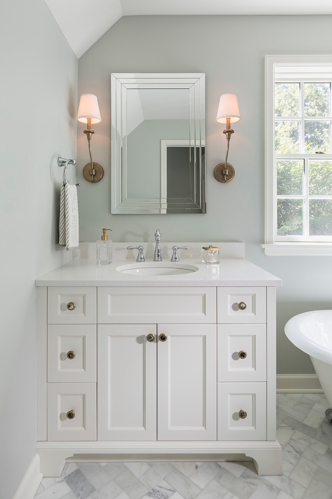 Inspiration for a large timeless master white tile and stone tile marble floor bathroom remodel in Minneapolis with recessed-panel cabinets, white cabinets, quartz countertops, gray walls and a console sink