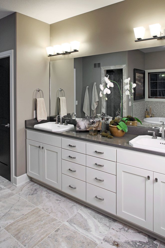 Inspiration for a medium sized contemporary ensuite bathroom in Omaha with white cabinets, grey tiles, beige walls, a built-in sink, a built-in bath, marble flooring, shaker cabinets, an alcove shower, a two-piece toilet, mosaic tiles, soapstone worktops, white floors and a hinged door.