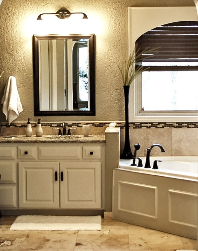 Example of a mid-sized trendy master beige tile and ceramic tile ceramic tile bathroom design in Kansas City with an undermount sink, raised-panel cabinets, white cabinets, granite countertops and beige walls