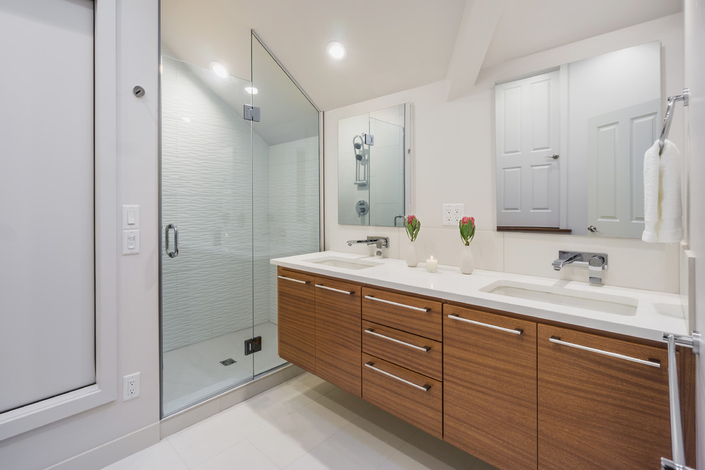 Inspiration for a small modern master white tile and ceramic tile ceramic tile and white floor alcove shower remodel in Portland with an undermount sink, medium tone wood cabinets, quartz countertops, a one-piece toilet, white walls, flat-panel cabinets and a hinged shower door