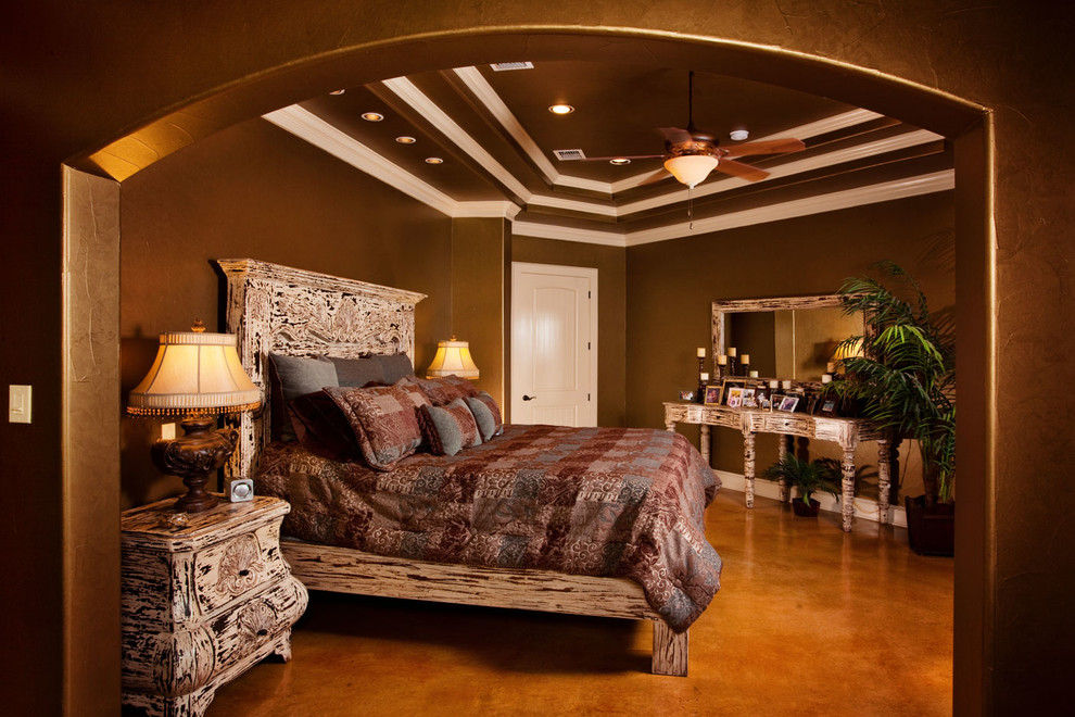 Large elegant bedroom photo in Austin with brown walls