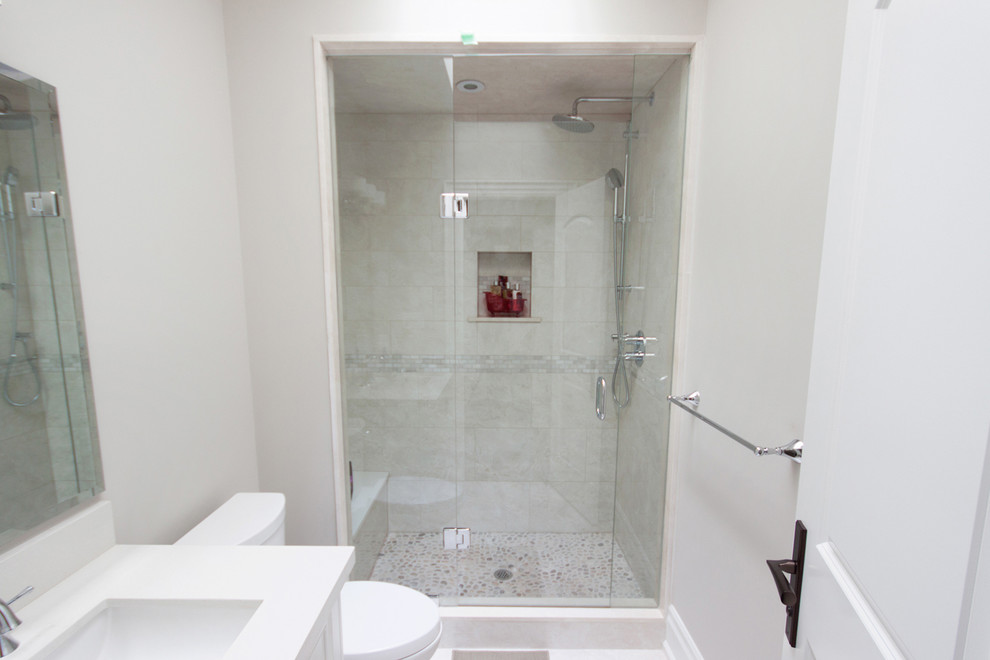 Medium sized traditional ensuite bathroom in Toronto with a freestanding bath, an alcove shower, a one-piece toilet, grey walls and marble flooring.