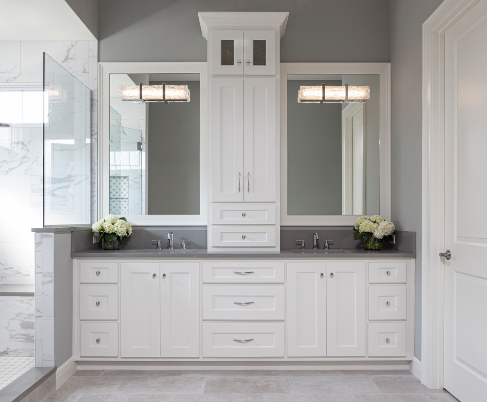 Large transitional master white tile and marble tile porcelain tile and gray floor alcove shower photo in Kansas City with recessed-panel cabinets, white cabinets, gray walls, an undermount sink, quartzite countertops, a hinged shower door and gray countertops