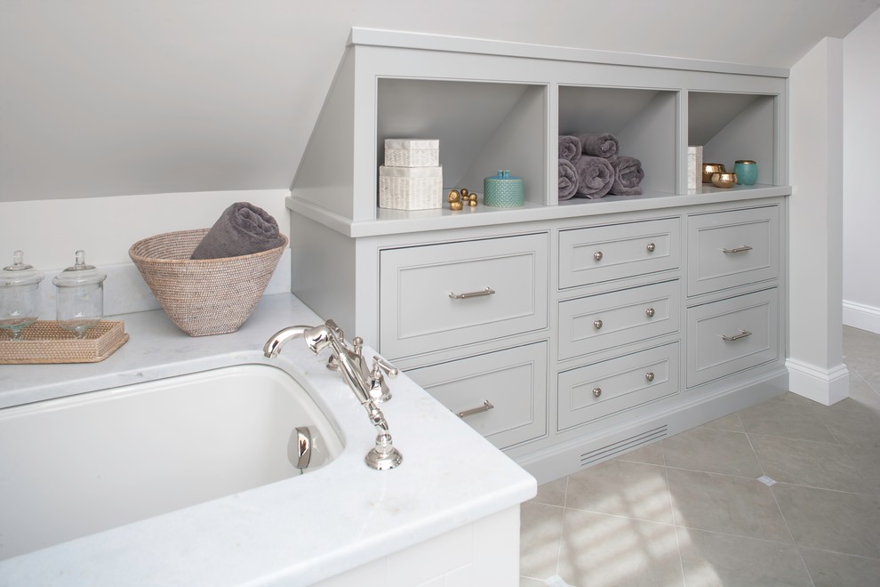 Photo of a large traditional ensuite bathroom in Bridgeport with recessed-panel cabinets, grey cabinets, a built-in bath, an alcove shower, grey tiles, white tiles, metro tiles, white walls, ceramic flooring, a submerged sink and marble worktops.