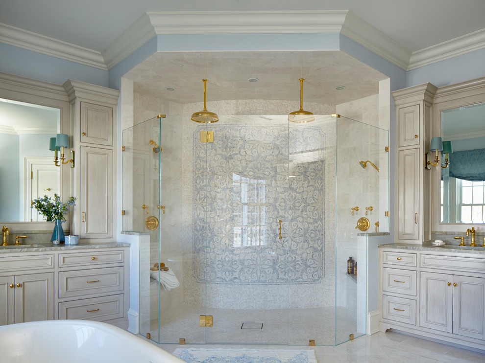 Example of a classic master gray tile and mosaic tile marble floor and gray floor bathroom design in New York with recessed-panel cabinets, gray cabinets, blue walls, an undermount sink, tile countertops, a hinged shower door and gray countertops