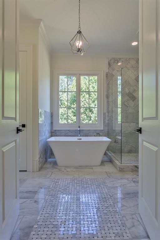 Large transitional master gray tile and marble tile marble floor and gray floor bathroom photo in Atlanta with recessed-panel cabinets, gray cabinets, a two-piece toilet, white walls, an undermount sink, marble countertops, a hinged shower door and gray countertops
