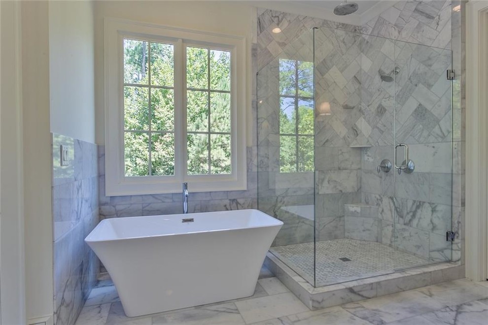 Inspiration for a large transitional master gray tile and marble tile marble floor and gray floor bathroom remodel in Atlanta with recessed-panel cabinets, gray cabinets, a two-piece toilet, white walls, an undermount sink, marble countertops, a hinged shower door and gray countertops