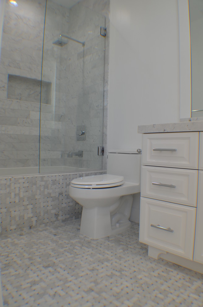 Example of a small transitional 3/4 multicolored tile and ceramic tile mosaic tile floor and multicolored floor bathroom design in Los Angeles with recessed-panel cabinets, white cabinets, a one-piece toilet, white walls, an undermount sink, concrete countertops, a hinged shower door and white countertops