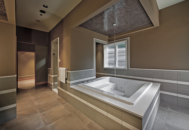 Expansive contemporary bathroom in Denver with a japanese bath.