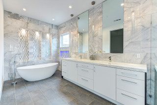 Ai generated bathroom with a freestanding soaking tub, glass-enclosed  shower, and floating vanity with double sinks. The bathroom has white tile  walls and floors, with a large window 35173114 Stock Photo at