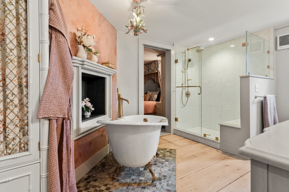 Classic bathroom in Boston with a claw-foot bath, a corner shower, white tiles, grey walls, light hardwood flooring, beige floors, a hinged door, white worktops and a shower bench.