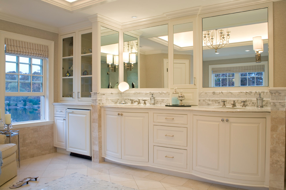 Large elegant white tile marble floor bathroom photo in Boston with an undermount sink, beaded inset cabinets, white cabinets, marble countertops, an undermount tub and beige walls