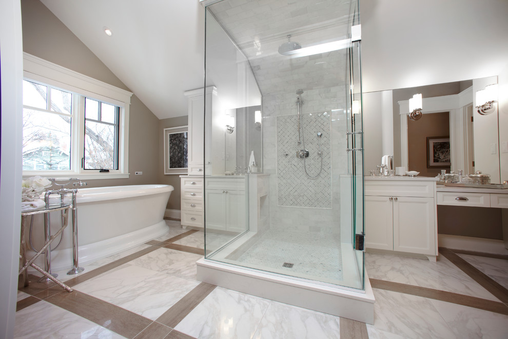Medium sized contemporary ensuite bathroom in Calgary with a submerged sink, white cabinets, a freestanding bath, a one-piece toilet, white tiles, white walls and medium hardwood flooring.