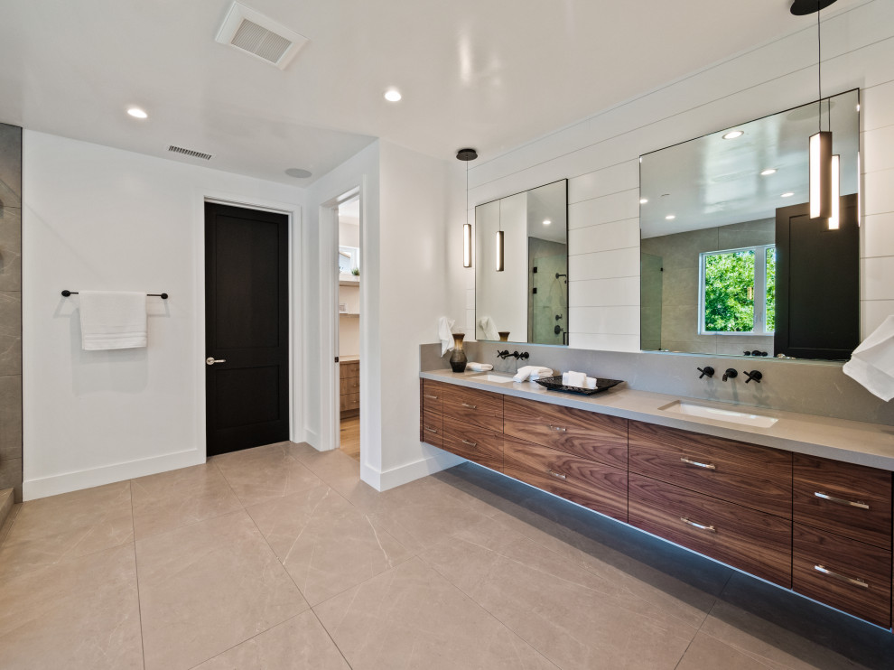 Medium sized farmhouse ensuite bathroom in Los Angeles with flat-panel cabinets, dark wood cabinets, engineered stone worktops, grey worktops, an enclosed toilet, double sinks and a floating vanity unit.
