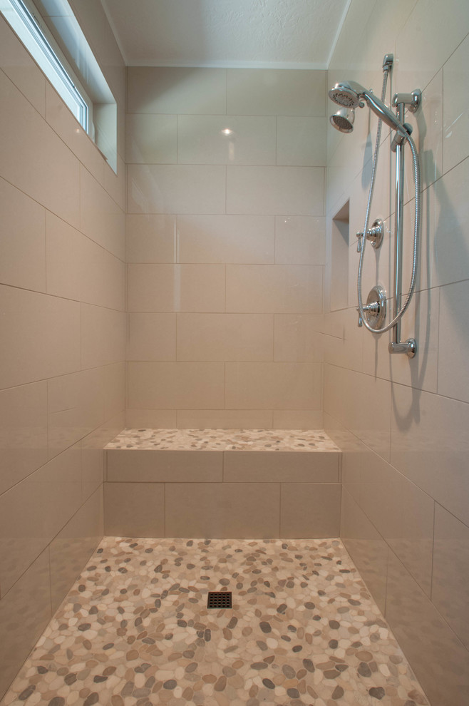 Large traditional ensuite bathroom in Boise with a built-in sink, recessed-panel cabinets, white cabinets, quartz worktops, a claw-foot bath, a walk-in shower, a two-piece toilet, brown tiles, porcelain tiles, beige walls and porcelain flooring.