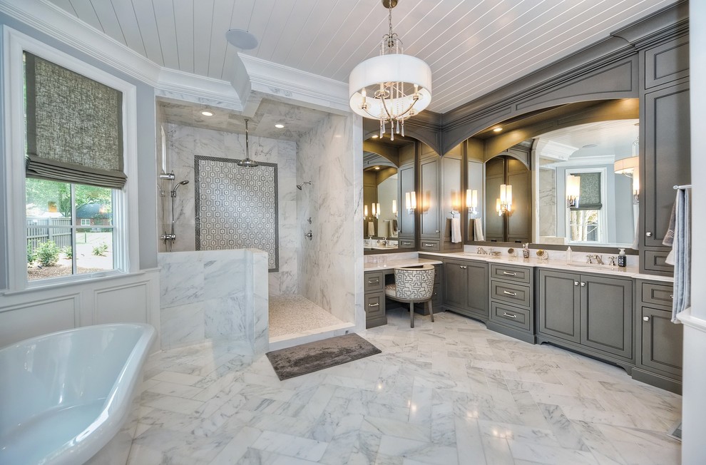 Bathroom - transitional master marble floor bathroom idea in Charlotte with an undermount sink, beaded inset cabinets, marble countertops and a two-piece toilet