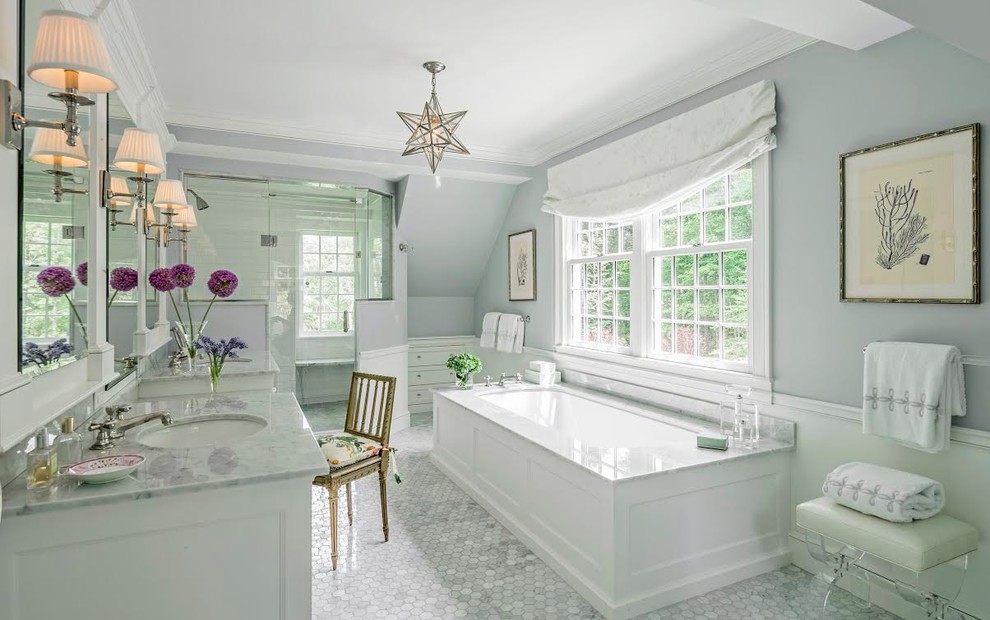 Large classic ensuite bathroom in Boston with recessed-panel cabinets, white cabinets, a submerged bath, an alcove shower, grey tiles, ceramic tiles, blue walls, ceramic flooring, a built-in sink and marble worktops.