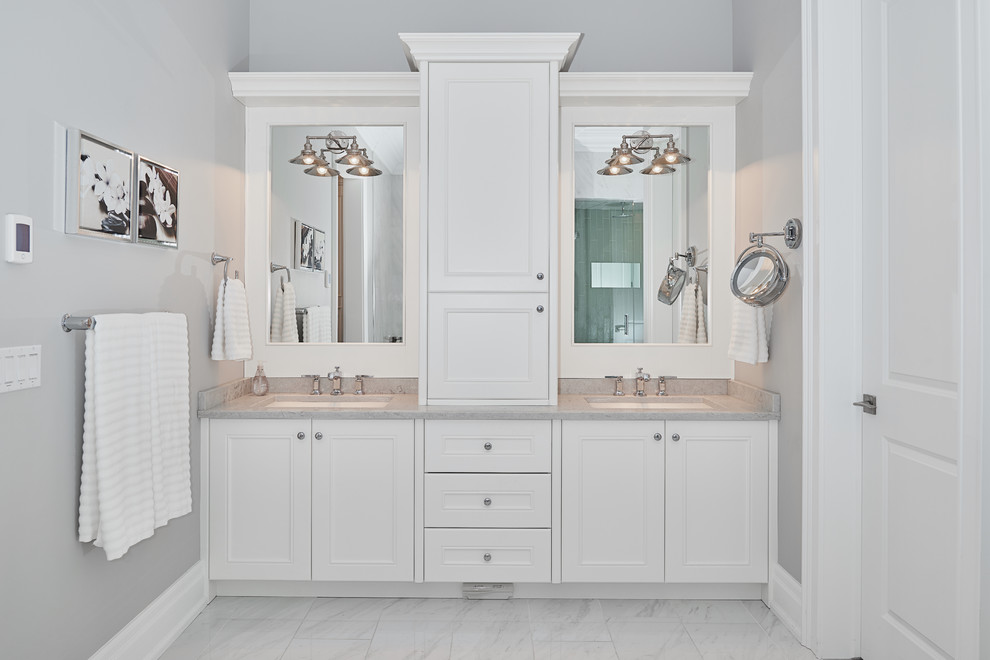 Design ideas for a large classic ensuite bathroom in Edmonton with shaker cabinets, white cabinets, an alcove shower, a one-piece toilet, white tiles, grey walls, porcelain flooring, a submerged sink and a built-in bath.