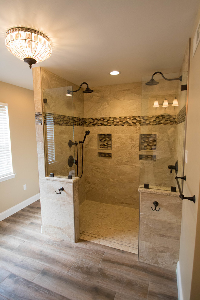 Inspiration for a mid-sized timeless master beige tile and porcelain tile porcelain tile and brown floor bathroom remodel in Philadelphia with recessed-panel cabinets, beige cabinets, a two-piece toilet, beige walls, an undermount sink and quartz countertops