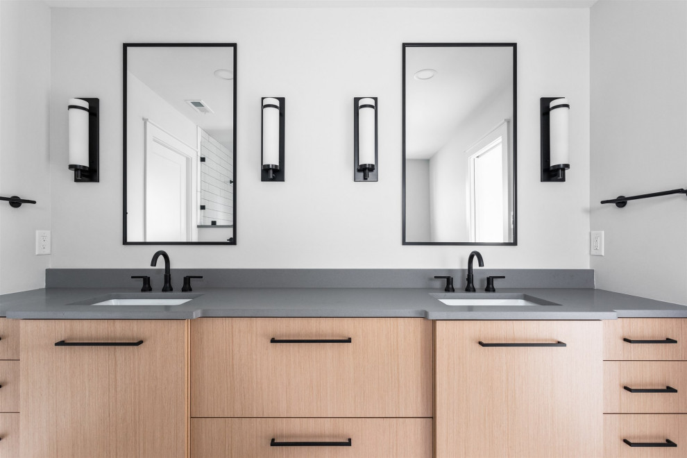 Inspiration for a traditional ensuite bathroom in Indianapolis with flat-panel cabinets, light wood cabinets, a corner shower, ceramic tiles, grey walls, ceramic flooring, a submerged sink, engineered stone worktops, grey floors, a hinged door, grey worktops, a shower bench, double sinks and a built in vanity unit.